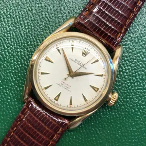 1952 Rolex Bombay 6090 Oyster Perpetual 14K Yellow Gold Red “Officially” Original Dial Wristwatch