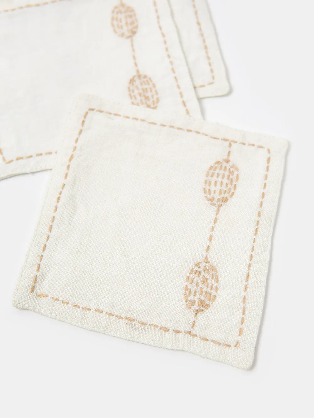 Set of 4 Totem Coasters in Hand-embroidered Soft White Linen