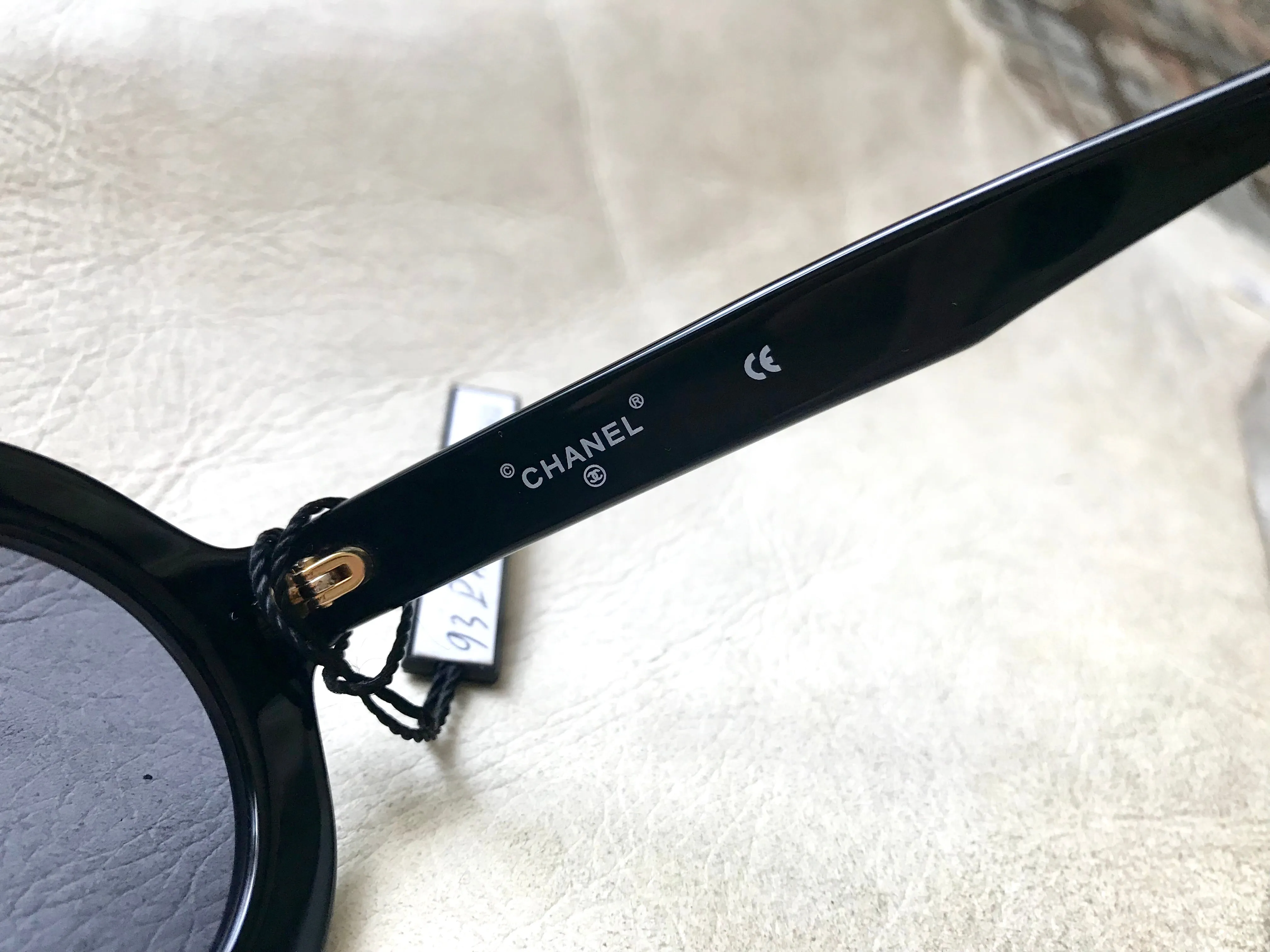 Vintage CHANEL black round frame mod sunglasses with white CHANEL PARIS logo. 060412