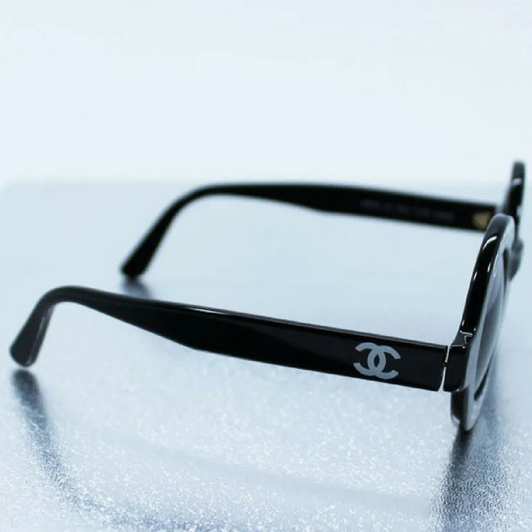 Vintage CHANEL black round frame mod sunglasses with white CHANEL PARIS logo. 060412